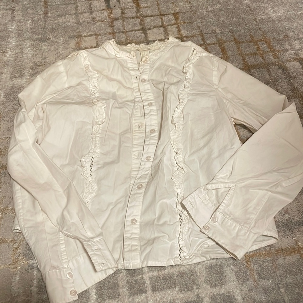 White button down with ruffle details